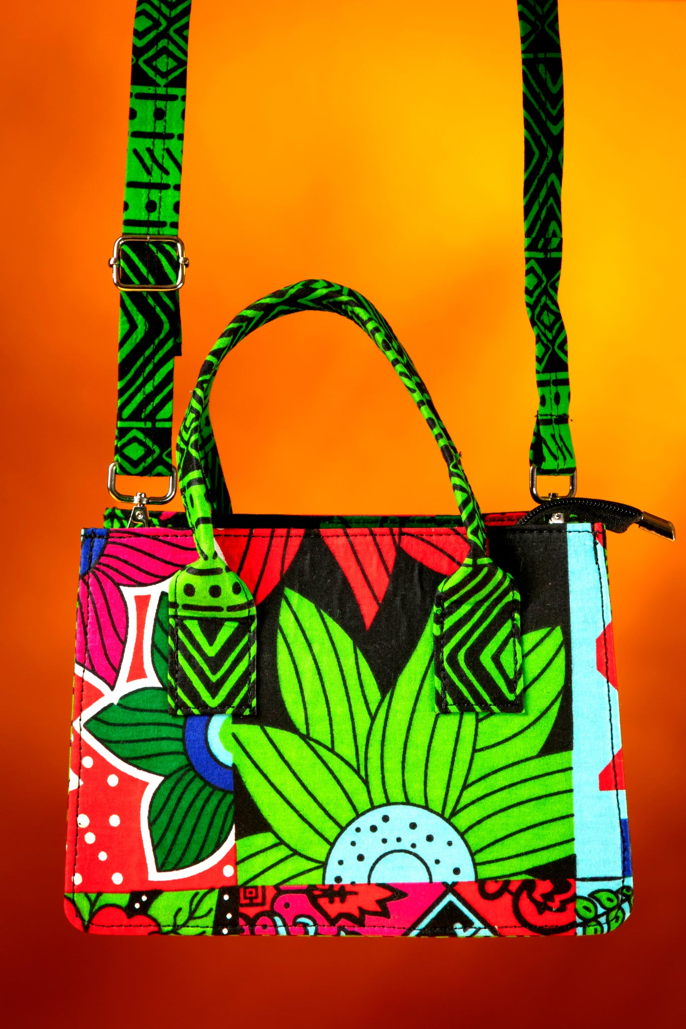 Front view of the Balangi Bag with the strap attached, highlighting the vibrant  contrast between the body and the strap, handmade with African wax cotton.