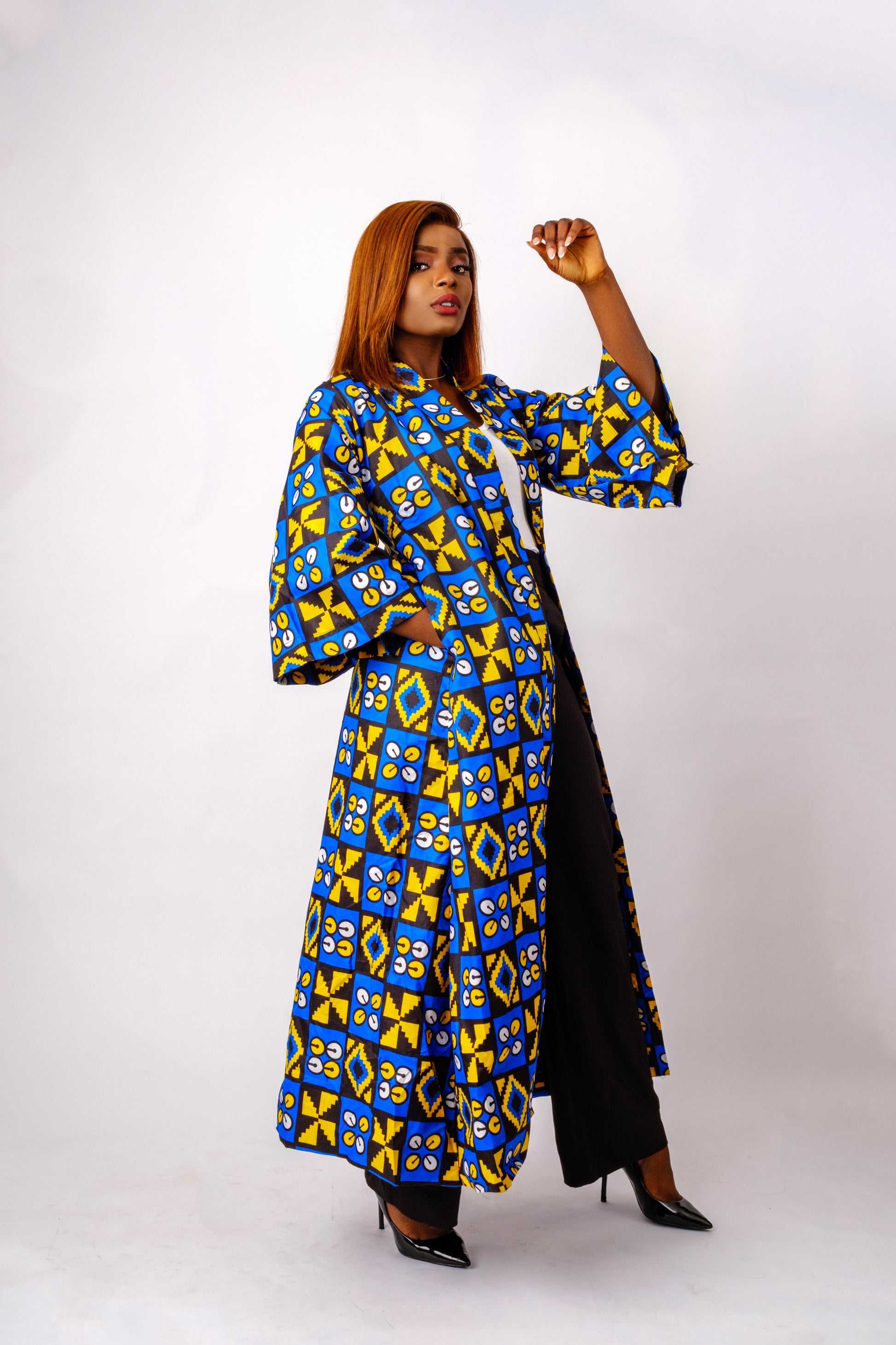 Blue African print (Ankara) kimono made of a lightweight cotton material that features a mix of geometric tribal designs
