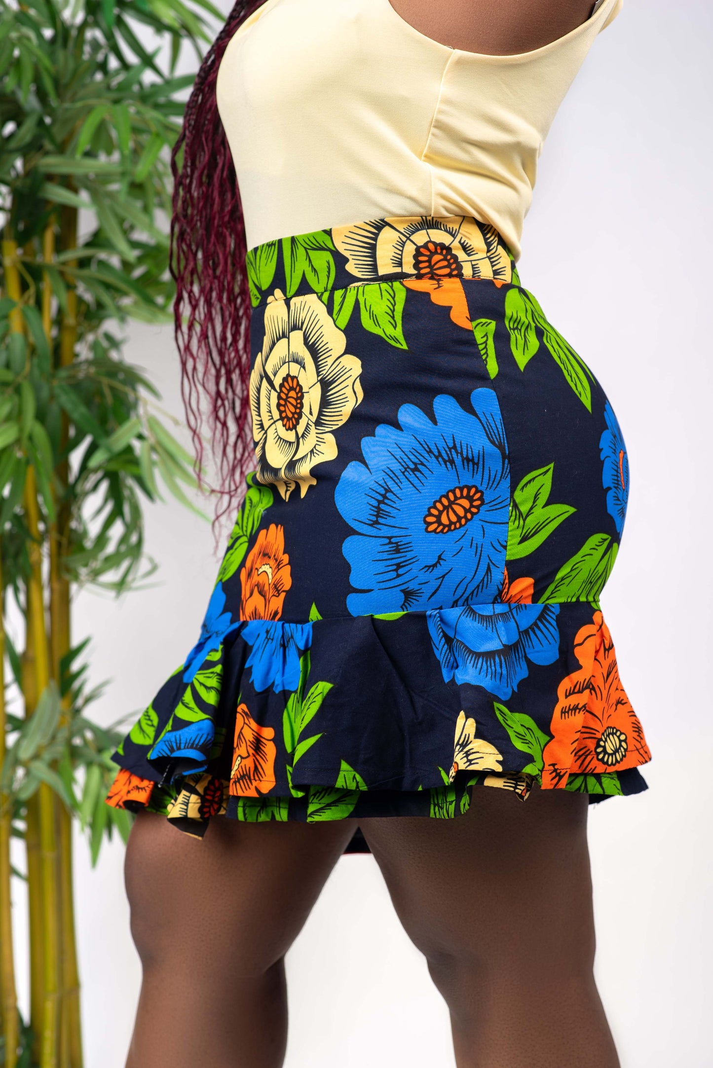 This African print skirt is Asymmetrical and features ruffles at the bottom. The asymmetrical hemline adds an element of interest, and the ruffles are fun and flirty. This skirt is perfect for women who want to stand out and be unique. Skirt is named after the Igbo ethnic group (from Nigeria) dance style; Atilogwu. Ankara skirt