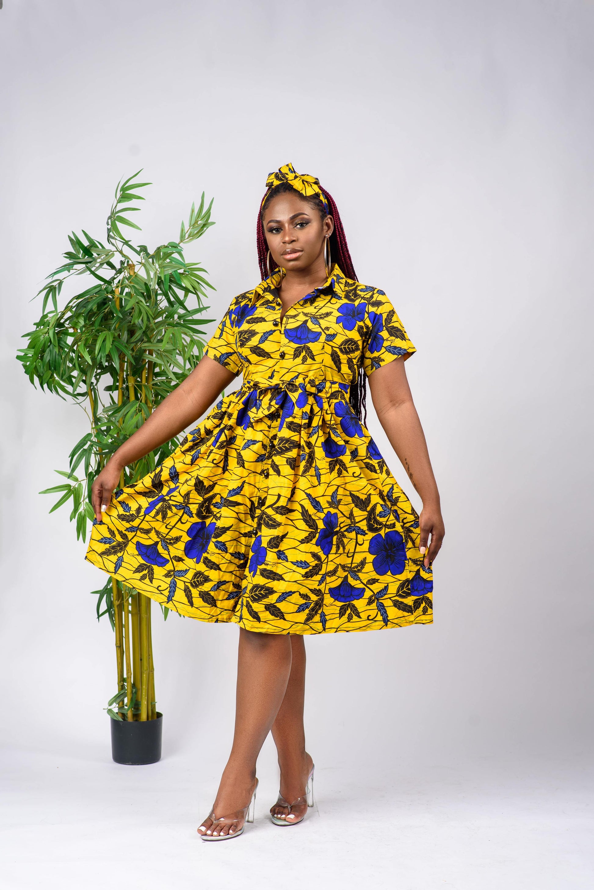 This African Print shirt dress is a beautiful, short-sleeved dress that can be worn to any occasion such as to work or for a date. The dress is button-down and can be paired with a belt to cinch the waist.   Dress is named after the Akwa-Ibom (in Nigeria) dance style; Etighi.  Ankara wax cotton