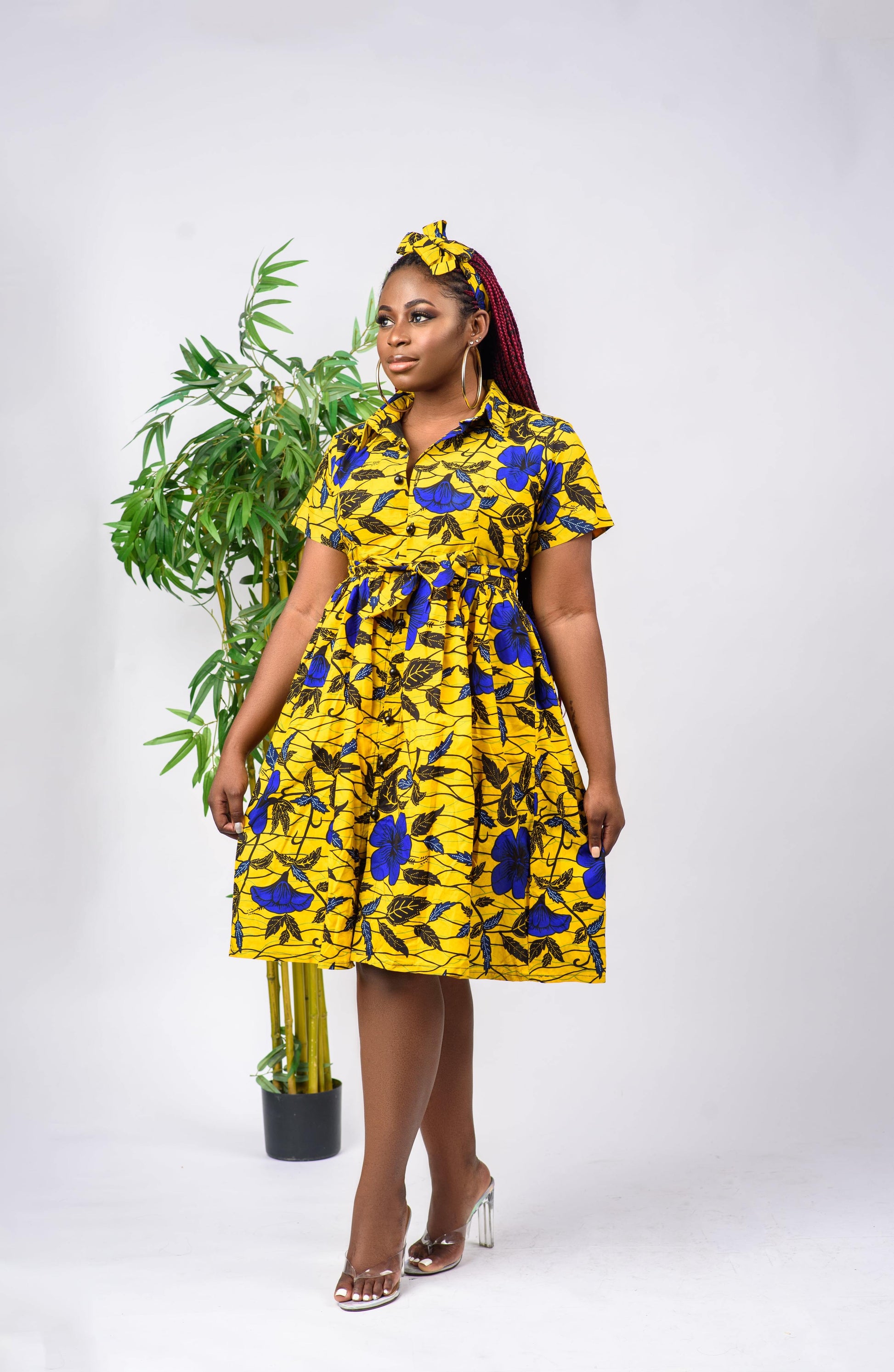 This African Print shirt dress is a beautiful, short-sleeved dress that can be worn to any occasion such as to work or for a date. The dress is button-down and can be paired with a belt to cinch the waist.   Dress is named after the Akwa-Ibom (in Nigeria) dance style; Etighi.  Ankara wax cotton