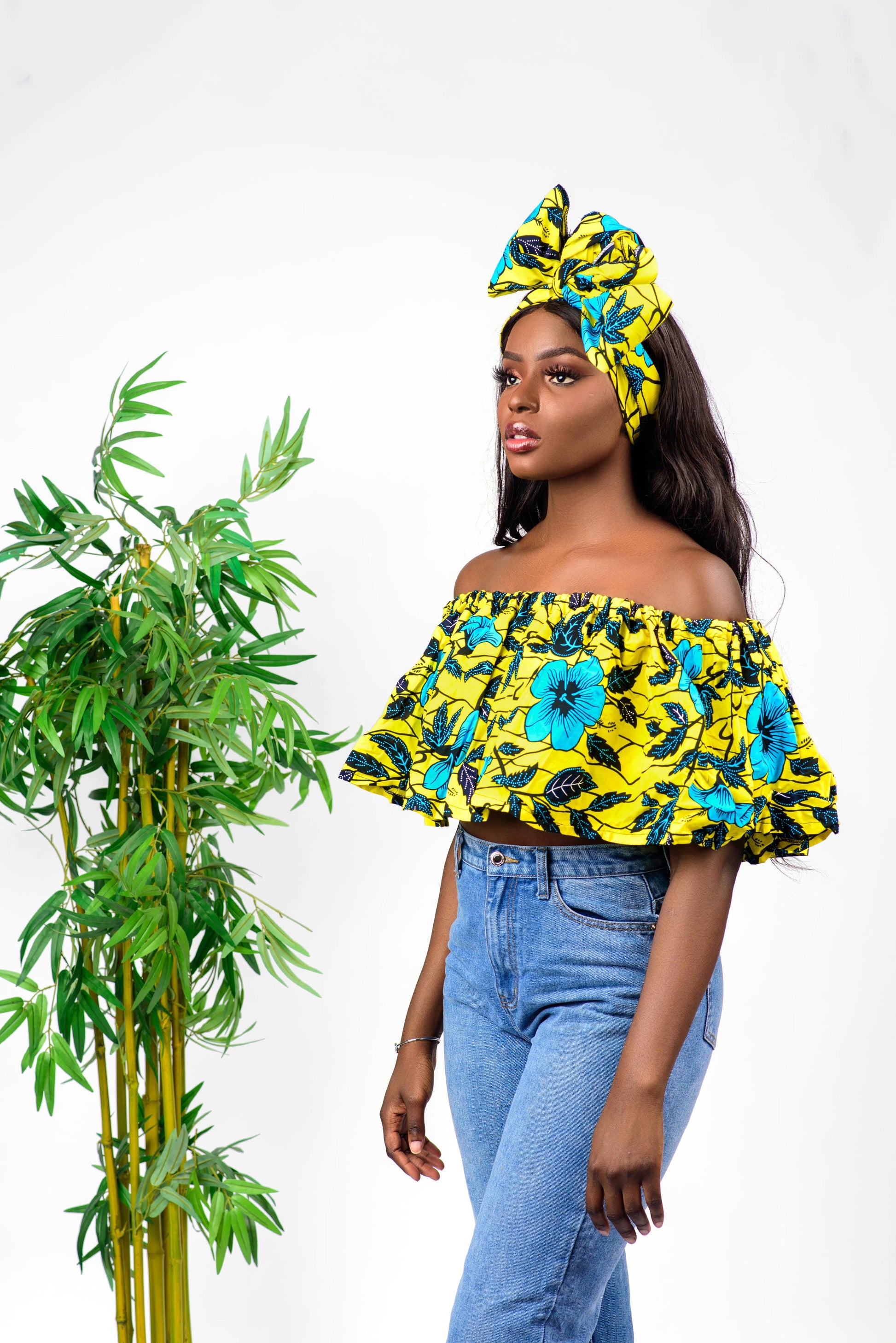 This African Print crop top is perfect for a night out on the town. The short sleeves and cropped length keep it from being too formal. The off the shoulder design allows for a more casual look, and the ruffles add a cute touch.   Top is named after the Cameroonian dance style; Makossa.   100% Ankara wax cotton 