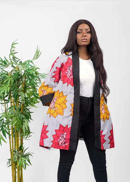 This African print kimono is a beautiful piece that can be worn as a jacket or a dress. The bold print of the kimono will get you noticed and the vibrant colors will make you stand out.  It can be paired with any outfit and can also be worn all year round.   Kimono is named after the Fulani ethnic group (from Nigeria) dance style; Sharo   Ankara wax cotton