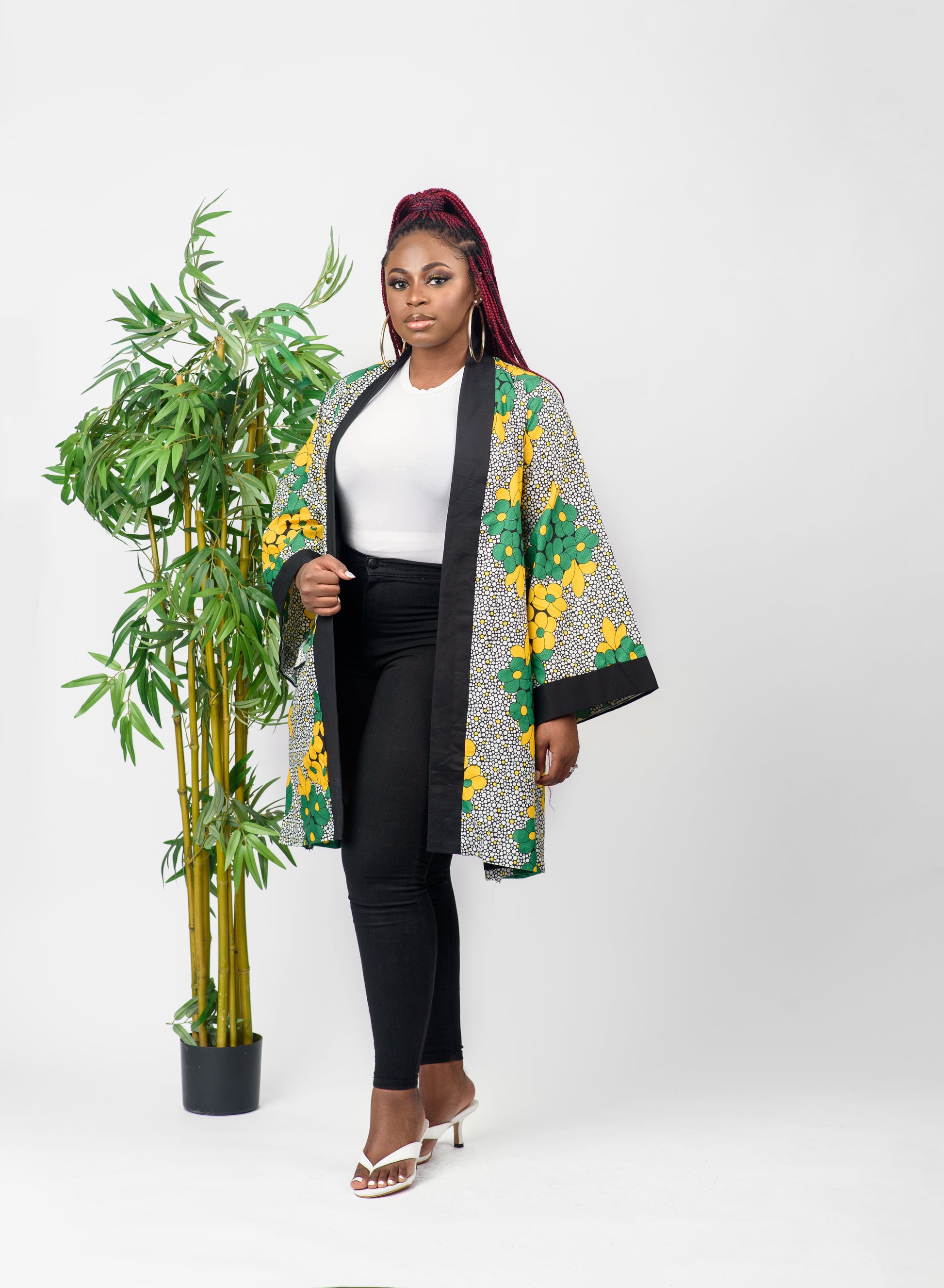 This African print kimono is a beautiful piece that can be worn as a jacket or a dress. The bold print of the kimono will get you noticed and the vibrant colors will make you stand out.  It can be paired with any outfit and can also be worn all year round.   Kimono is named after the Tiv ethnic group (from Nigeria) dance style; Swange   Ankara wax cotton